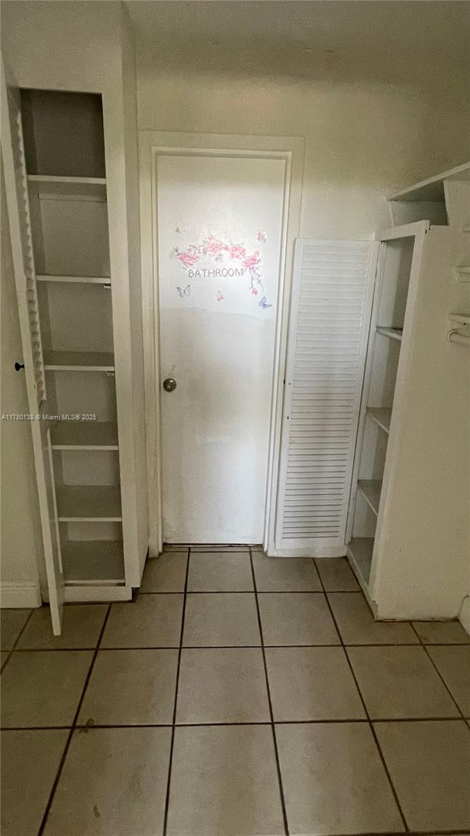 1805 Sans Souci Boulevard, Unit 302R North Miami, FL 33181 - Photo 19 of 33 a view of a hallway