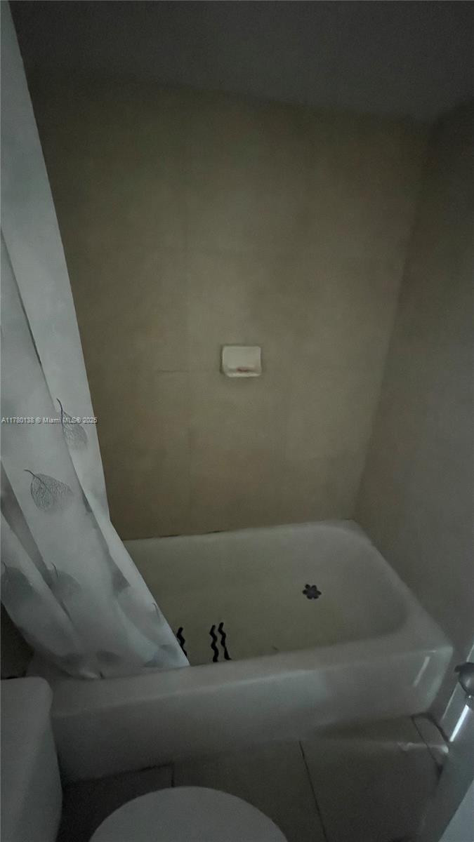 1805 Sans Souci Boulevard, Unit 302R North Miami, FL 33181 - Photo 20 of 33 a bathroom with a bathtub