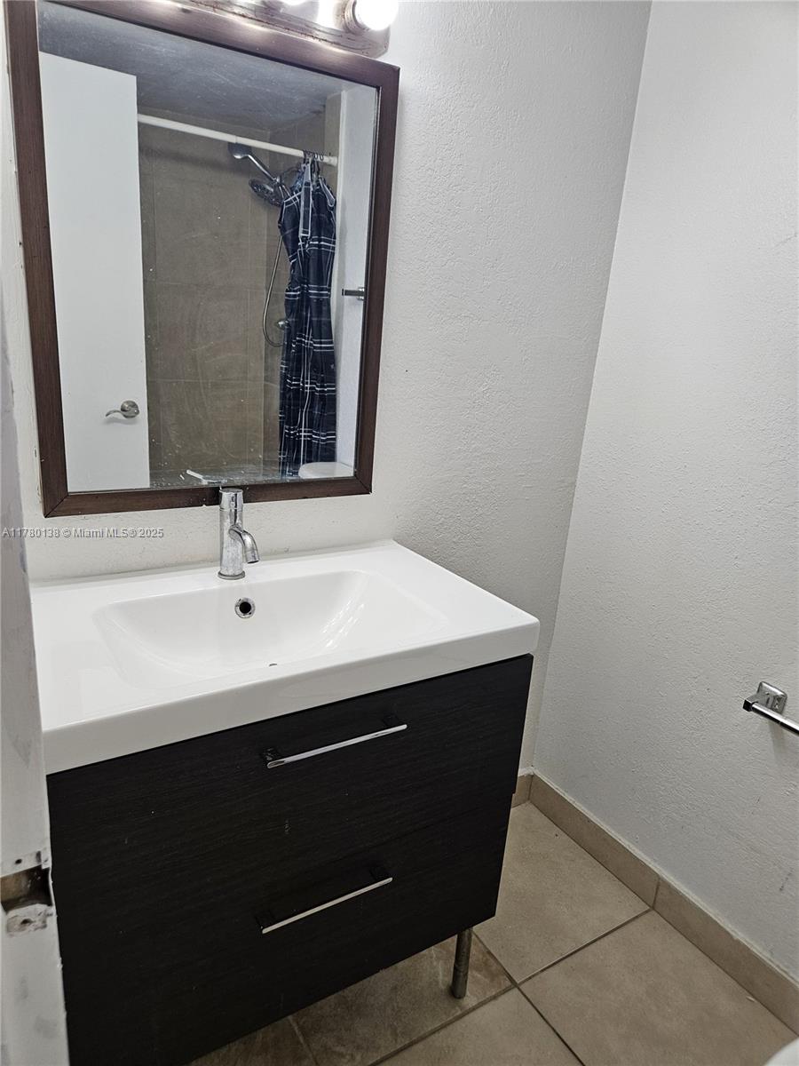 1805 Sans Souci Boulevard, Unit 302R North Miami, FL 33181 - Photo 21 of 33 a close view of sink and mirror