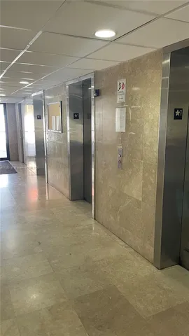 a view of a swimming pool with a yard