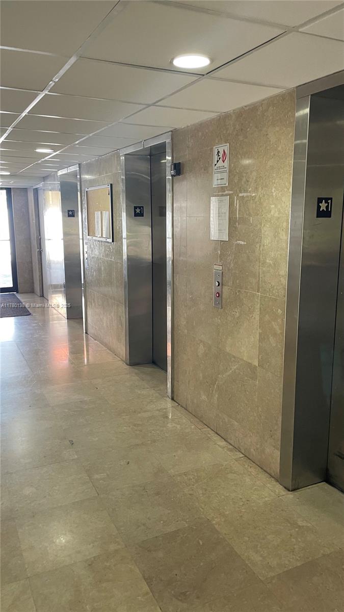 1805 Sans Souci Boulevard, Unit 302R North Miami, FL 33181 - Photo 28 of 33 a bathroom with a glass shower door