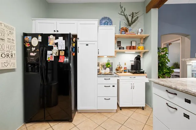 a kitchen with stainless steel appliances cabinets and a counter top space
