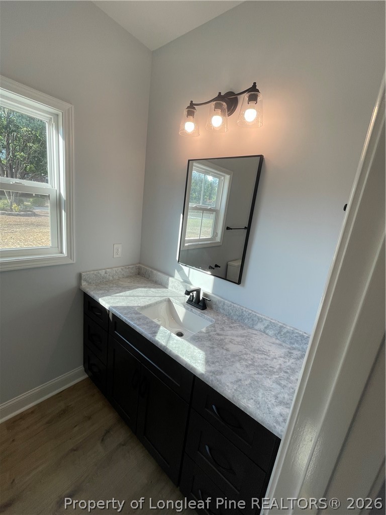 2677 Smith Mill Road Lumberton, NC 28358 - Photo 12 of 27 a bathroom with a granite countertop sink and a mirror