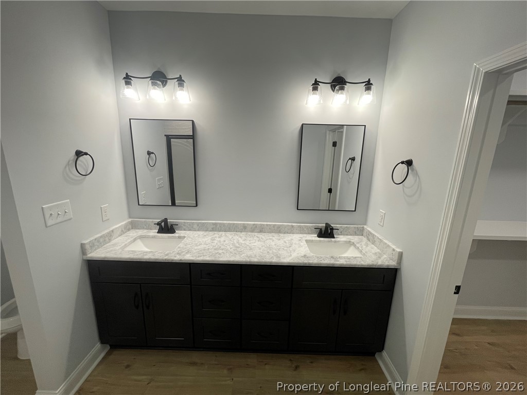 2677 Smith Mill Road Lumberton, NC 28358 - Photo 15 of 27 a bathroom with double sink and a mirror