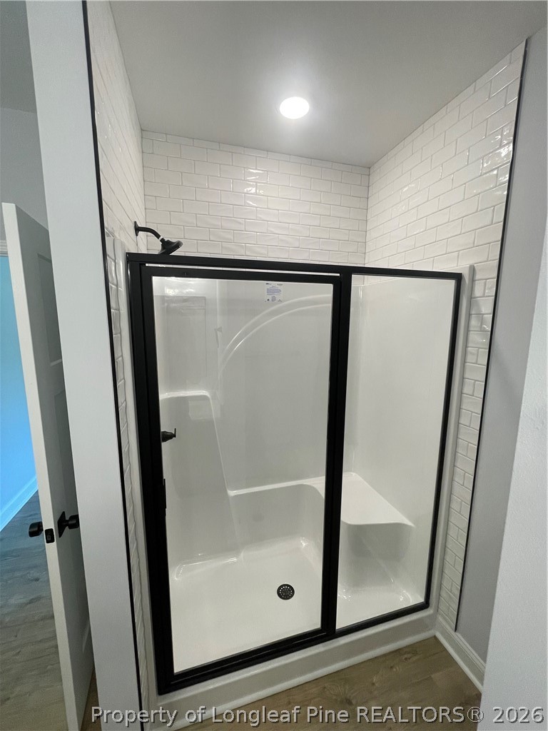 2677 Smith Mill Road Lumberton, NC 28358 - Photo 16 of 27 a bathroom with a glass door shower and mirror