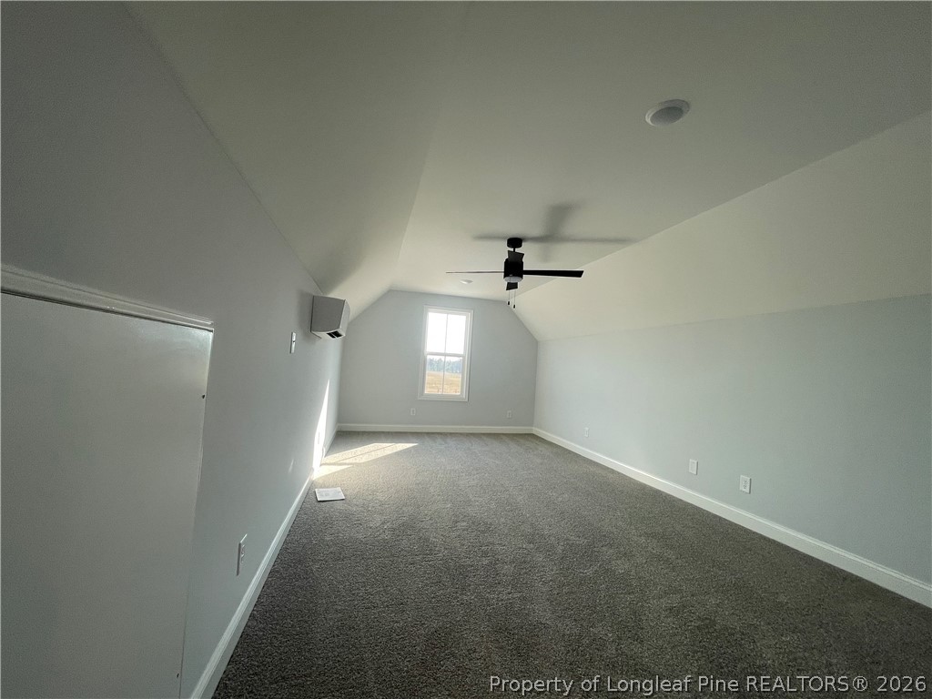 2677 Smith Mill Road Lumberton, NC 28358 - Photo 27 of 27 a view of a big room with a chandelier fan and windows