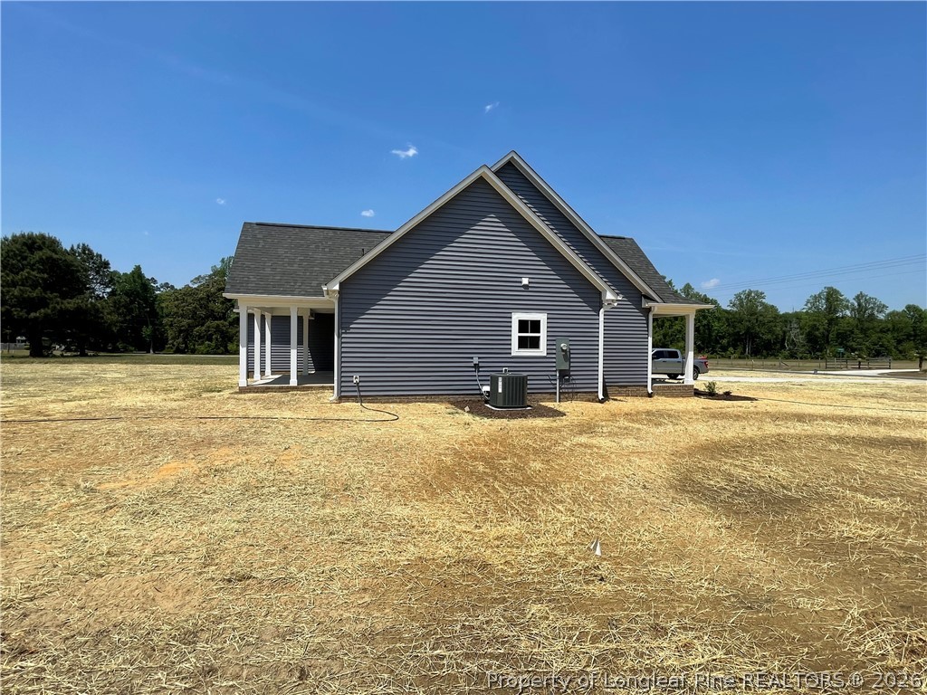 2677 Smith Mill Road Lumberton, NC 28358 - Photo 4 of 27 a house with swimming pool in front of it