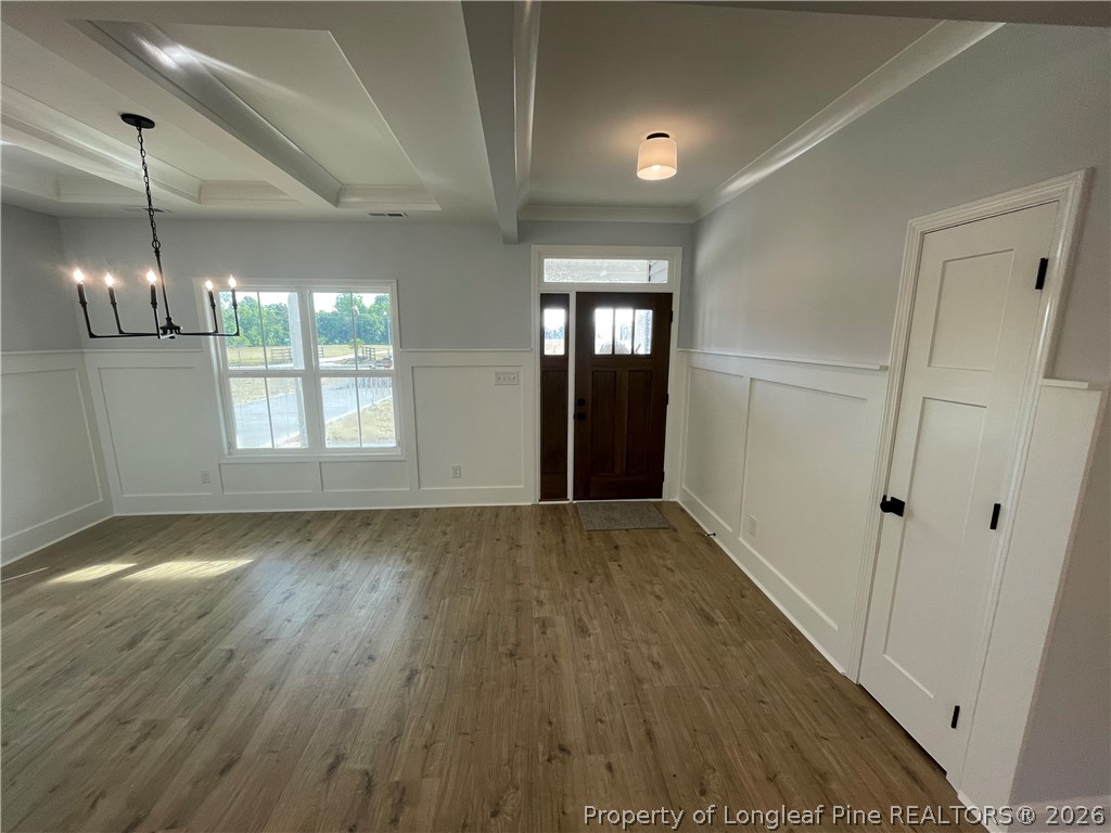 2677 Smith Mill Road Lumberton, NC 28358 - Photo 6 of 27 a view of an empty room with wooden floor and a window