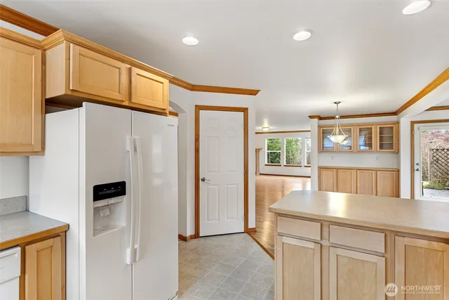 a view of a refrigerator and a window