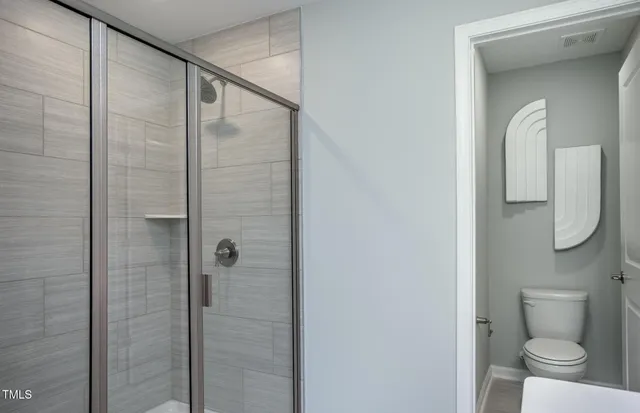 a bathroom with a double vanity sink mirror and double