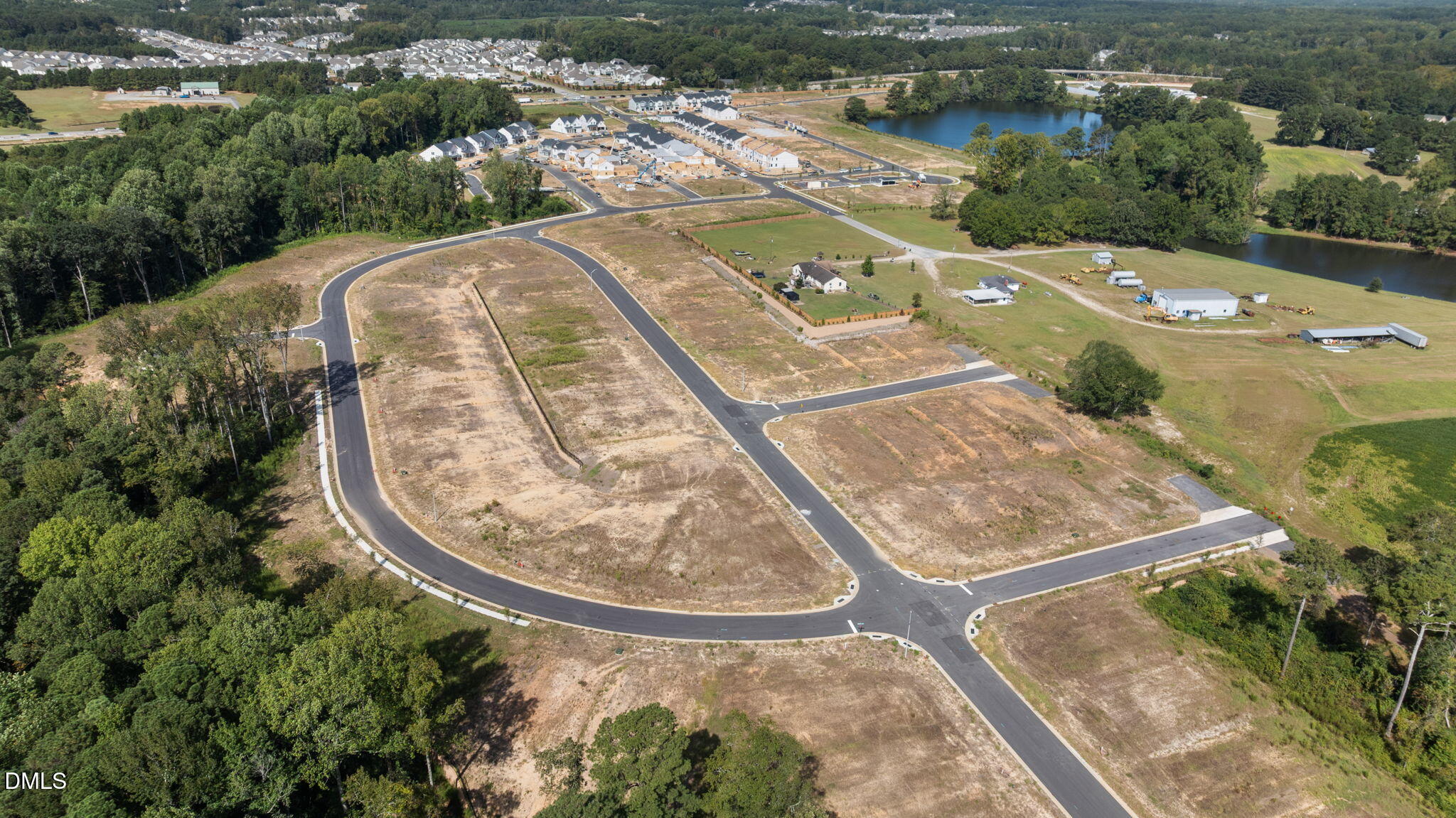 2919 Denson Road Fuquay-Varina, NC 27526 - Photo 22 of 26 an aerial view of a house with a yard and lake view