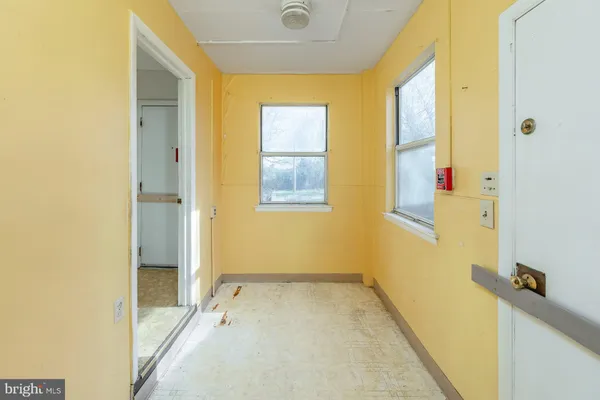 a view of a bathroom with a tub and shower