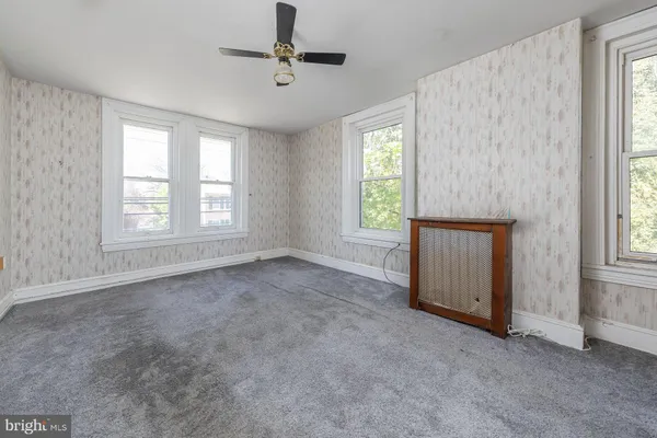 a view of an empty room with a window