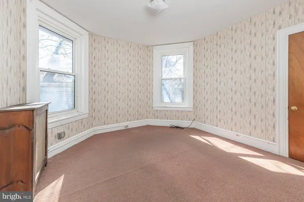 an empty room with windows
