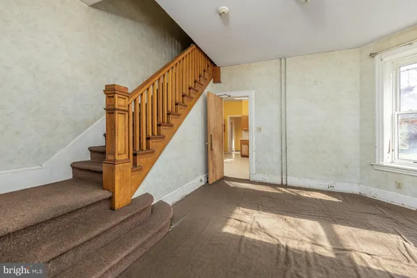 a view of an entryway with wooden floor and door
