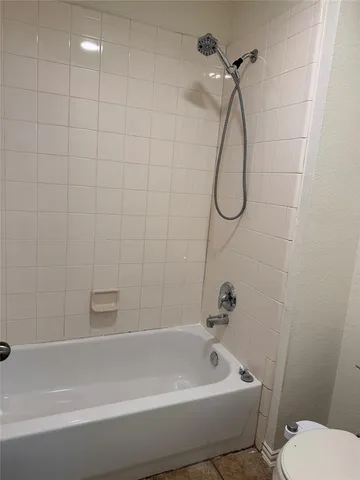 a bathroom with a bath tub and a shower