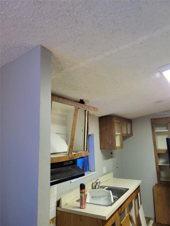 16842 Diagonal Road Hudson, FL 34667 - Photo 13 of 17 a bathroom with a sink and a mirror