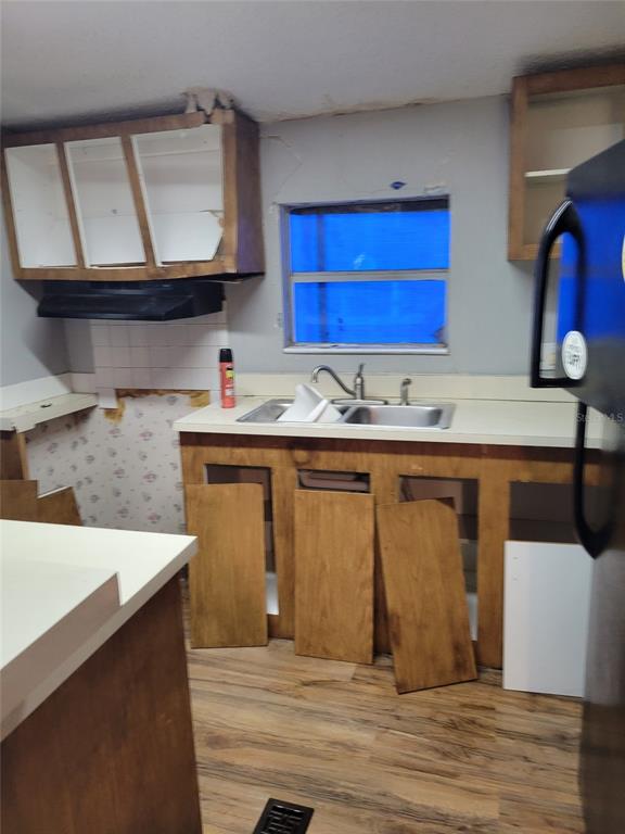 16842 Diagonal Road Hudson, FL 34667 - Photo 2 of 17 a kitchen with stainless steel appliances granite countertop a sink stove and cabinets
