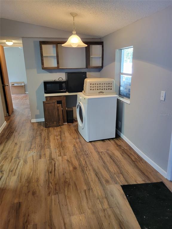 16842 Diagonal Road Hudson, FL 34667 - Photo 4 of 17 a view of kitchen with microwave and stove