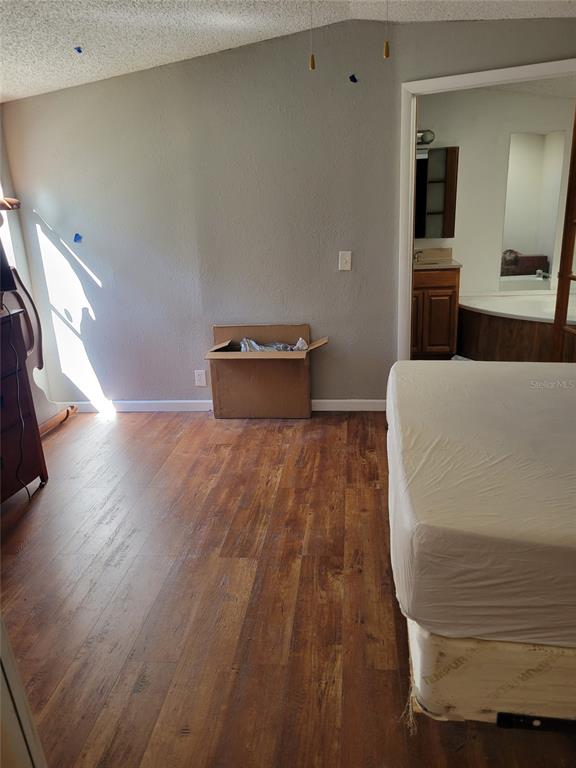 16842 Diagonal Road Hudson, FL 34667 - Photo 9 of 17 a living room with a couch and a table