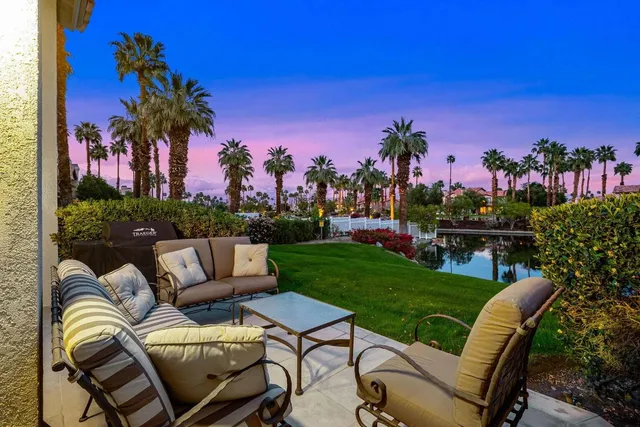a view of a chair and tables in the patio
