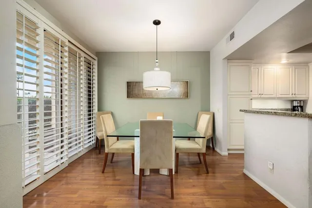 a dining room with furniture and window