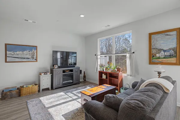a living room with furniture and a window