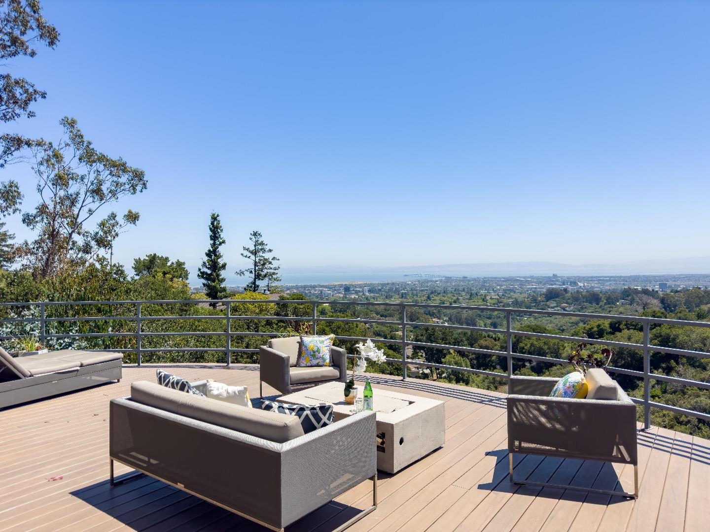 1305 Southdown Road Hillsborough, CA 94010 - Photo 2 of 72 a view of a roof deck with couches and sky view
