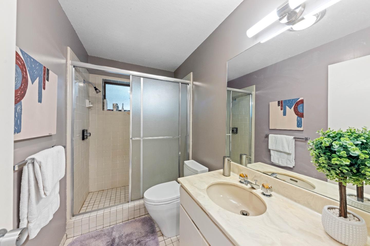 1305 Southdown Road Hillsborough, CA 94010 - Photo 42 of 72 a bathroom with a sink toilet and shower