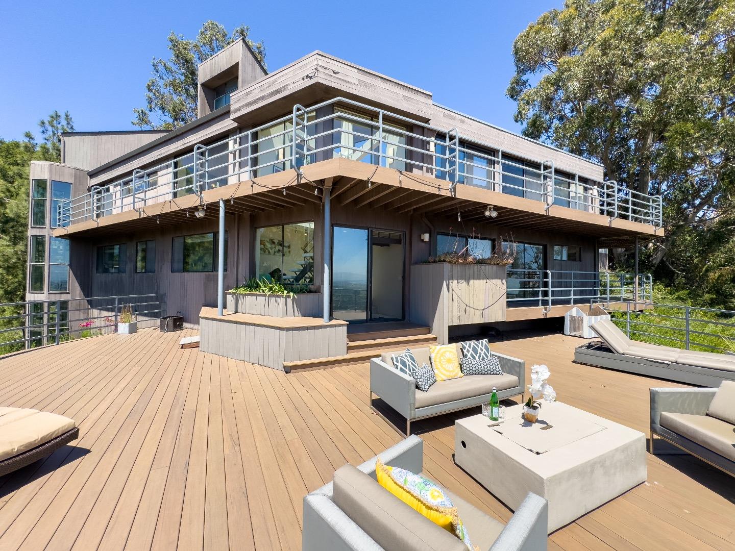 1305 Southdown Road Hillsborough, CA 94010 - Photo 46 of 72 a view of a dinning table and chairs in the patio in front of a house