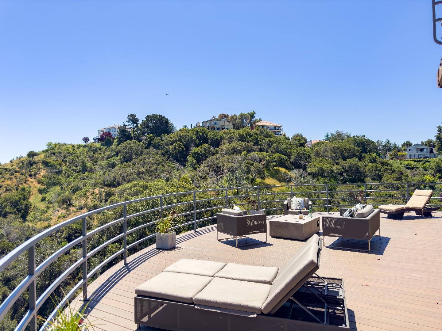 1305 Southdown Road Hillsborough, CA 94010 - Photo 65 of 72 a view of a balcony with a table and chairs