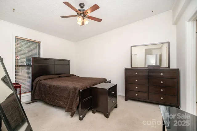 a bedroom with a bed and a closet