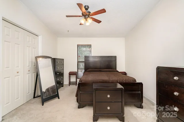 a bedroom with furniture and a bed