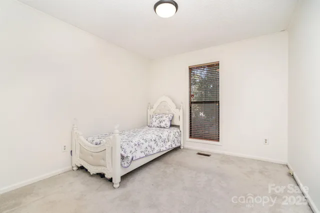 a view of a livingroom with entryway and bedroom