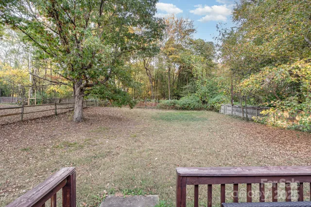 a backyard of a house with lots of green space