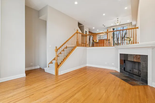 a kitchen with stainless steel appliances granite countertop wooden floor sink stove and granite counter top