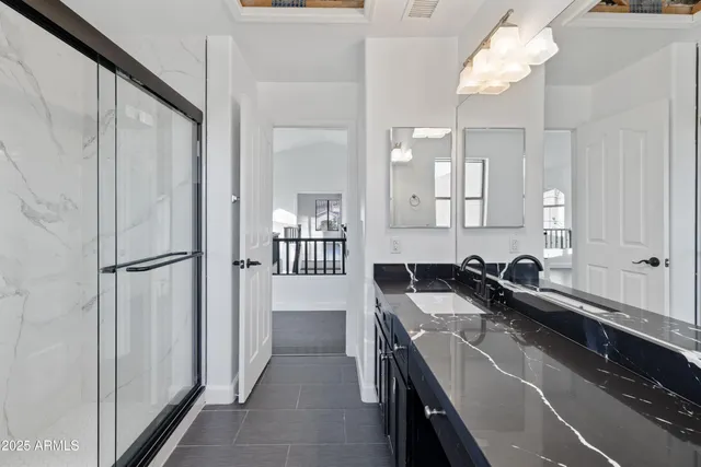 a kitchen with a sink a stove and cabinets
