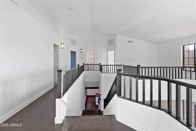a view of a hallway with staircase