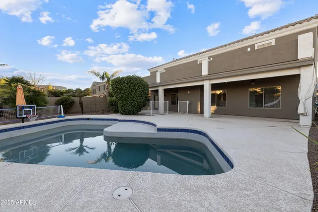 a view of a swimming pool with a patio