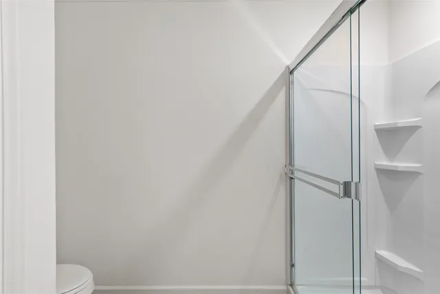 a view of a room with racks on the wall