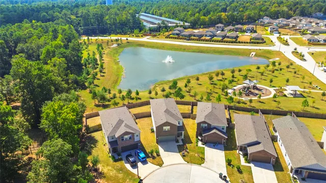view of swimming pool with outdoor seating and plants