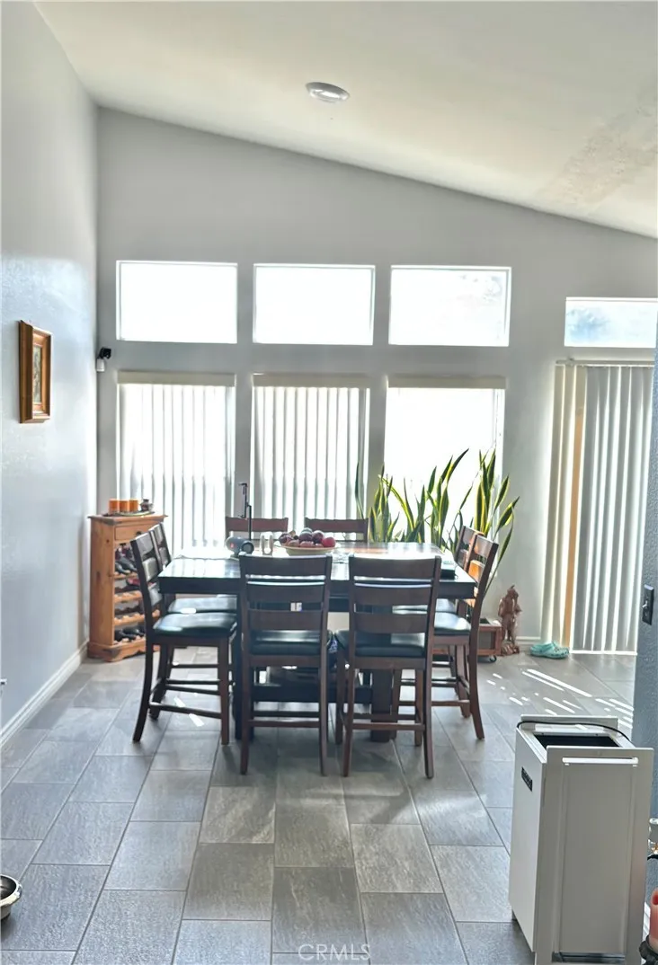 2830 Chuckwagon Road Palmdale, CA 93550 - Photo 2 of 11 a view of a workspace with furniture and a window