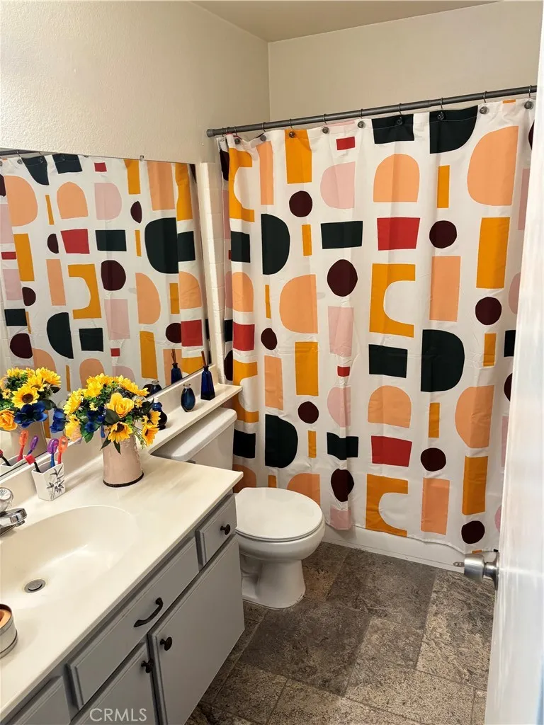 2830 Chuckwagon Road Palmdale, CA 93550 - Photo 3 of 11 a bathroom with a sink and a toilet