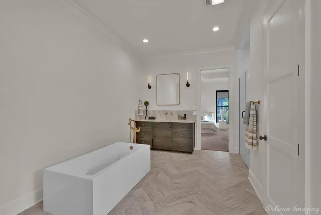 a bathroom with a tub sink and mirror