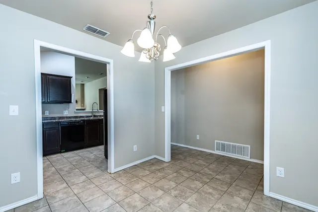 a view of a kitchen with a sink and a stove top oven