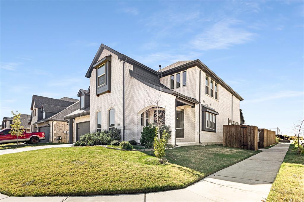 9000 Cisco Drive Denton, TX 76226 - Photo 1 of 1 View of side of home featuring a garage and a yard