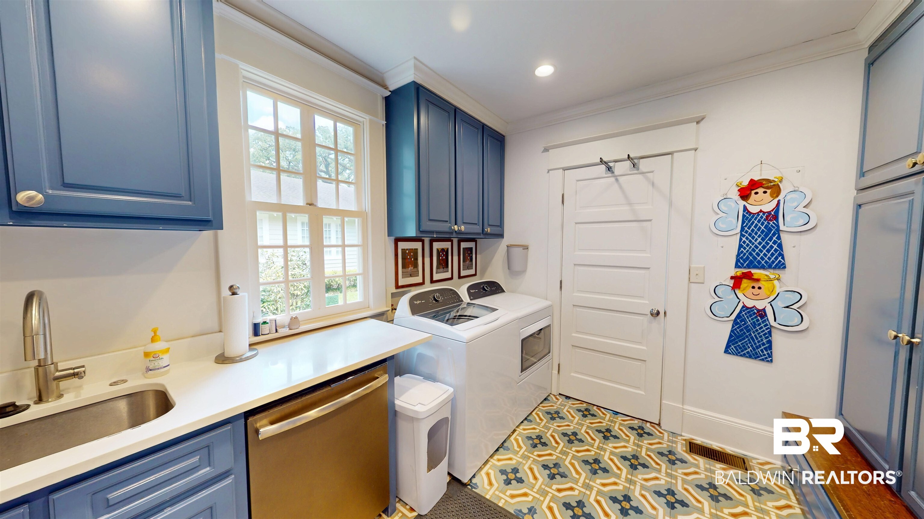 211 Lanier Avenue Mobile, AL 36607 - Photo 31 of 73 Laundry area featuring cabinet space, ornamental molding, and washer and clothes dryer