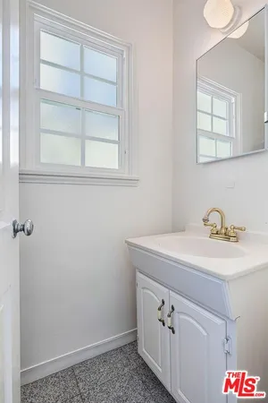 a bathroom with a sink and a vanity