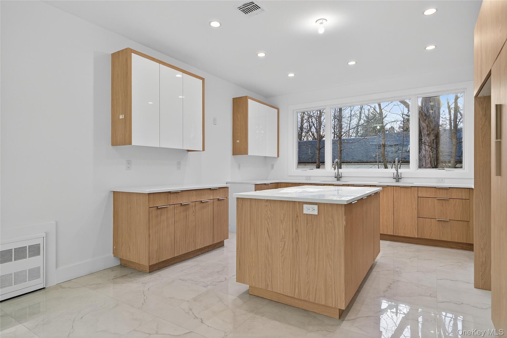 12 East Dillon Road, Unit 202 Monticello, NY 12701 - Photo 14 of 44 a spacious bathroom with a double vanity sink a mirror and a bathtub
