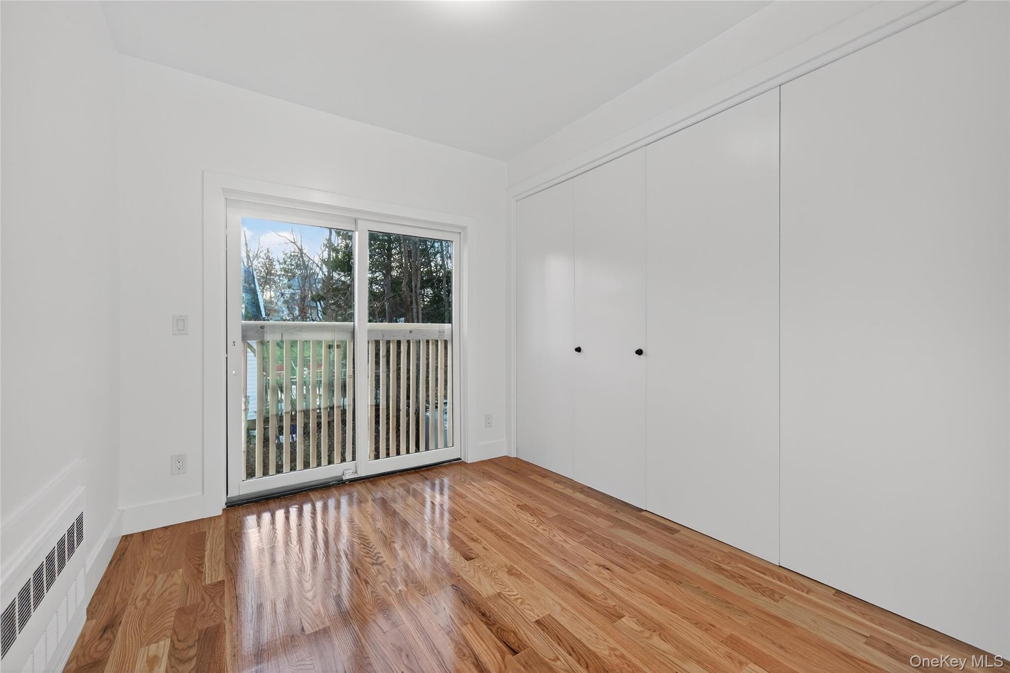 12 East Dillon Road, Unit 202 Monticello, NY 12701 - Photo 20 of 44 a view of a room with wooden floor and windows
